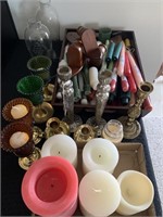 Several candles and holders.