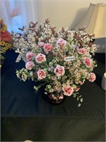 Three artificial floral arrangements.