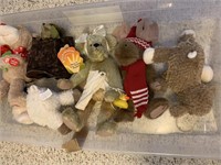 Tub of stuffed animals.