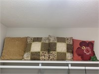 Four decorative pillows.