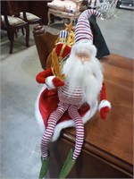 Santa  sits  12"
