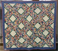 Quilt hand crafted in Eli Walker fabric with two