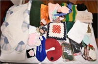 large lot to include assorted quilts, bedding,