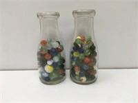 Two One Pint OI Milk Bottles Filled w/ Marbles