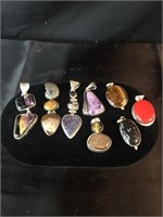 8 Sterling Silver Pendants with colored Gem Stones