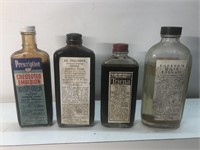Vintage lot of advertising pharmacy bottle s with