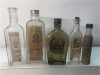 Antique lot of old medicine bottles with paper