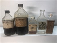 Vintage lot of advertising pharmacy bottles glass