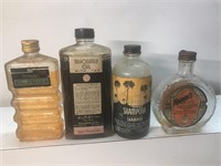 Antique lot of advertising glass bottles with