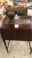 Kenmore sewing machine in cabinet