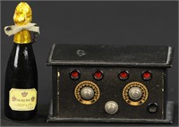 A CHAMPAGNE BOTTLE AND A RADIO RECEIVER