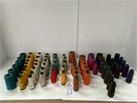 Large lot of large spools of thread.