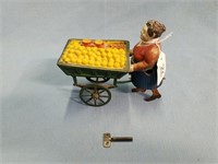 Antique Metal Wind-up Woman Pushing Cart