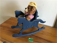 teddy bear in wood rocking horse