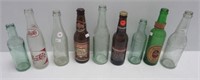 (9) Assorted glass bottles including Stroh's,