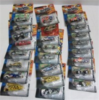 (25) Hot Wheels cars in packaging.