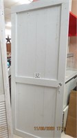 Wood shiplap style full pted white door.