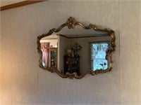 Gold-Framed Mirror Over Sofa
