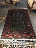 Signed Bokhara Green and Red Rug