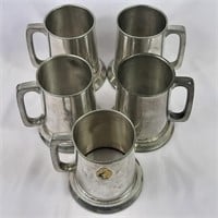 Five pewter beer steins including an RCMP logo