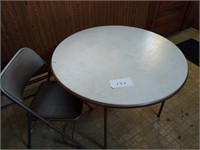 Round folding table and one folding chair