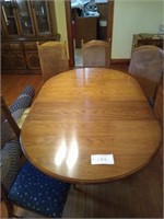 Dining room table with two leaves and four chairs