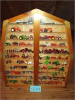 Barn shaped display case and toy tractors