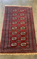 Vintage hand woven burgundy wool rug, with full