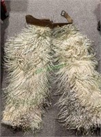 Antique cowboy woolly chaps, with a leather belt,