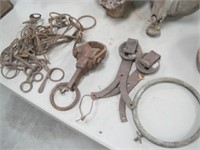 Group of horse bits, door rollers, rope binder