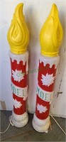 Pair of Noel candle blow molds, one candle top