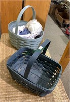 Two blue Longaberger baskets, one with a plastic
