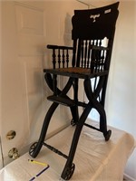 Antique Cane bottom, adjustable high chair