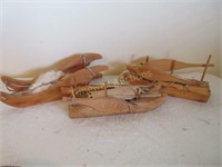 Handmade wooden boats and sled