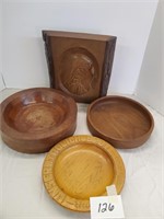 lot of wood bowls and a wood carving