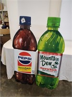 pair of pepsi and mt dew advertising pieces