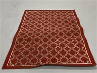 Red geometric patio area rug