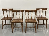 Four spindle back wood dining chairs