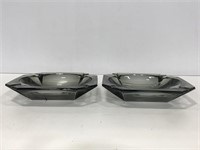 Two gray glass ashtrays