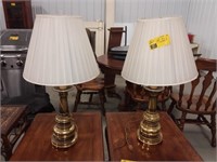 Two brass lamps