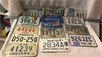 Lot of motorcycle license plates.