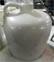 Lot #619 - Stoneware jug. Small chip to lip.