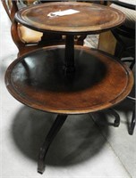 Lot #701 - Vintage mahogany leather top tiered