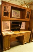 Lot #751 - Hooker Furniture oak desk unit.