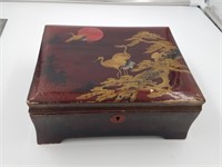 Vintage lacquered Chinese wood box with assortment