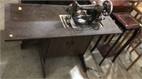 Sewing machine and table