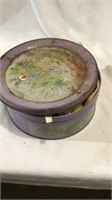 Metal tin with sewing supplies