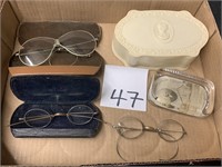 EYEGLASSES, PAPERWEIGHT AND PLASTIC BOX
