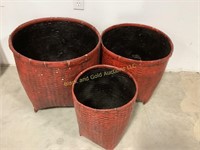 Three large woven decorative baskets