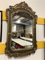 Wall mirror in fancy frame